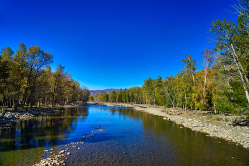 Poetic landscapes, clean blue skies, clear rivers, and lush trees, canyon.