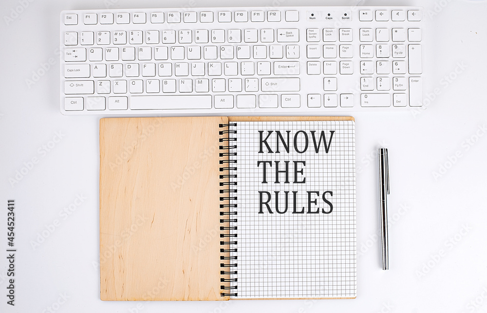 Poster know the rules text on the notebook with keyboard on white background