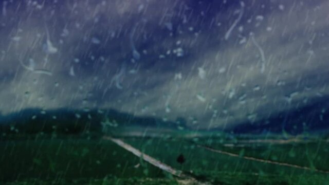 雨が滴る曇ったガラスと雨が降る草原の背景素材