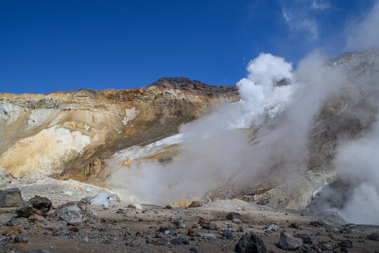 Landscape. the fumarole valley of the Mutnovsky volcano, in which you can see columns of steam of boiling water and sulfur. then the ascent takes place on the glacier . Kamchatka Peninsula