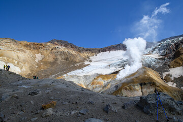 Landscape. the fumarole valley of the Mutnovsky volcano, in which you can see columns of steam of boiling water and sulfur. then the ascent takes place on the glacier . Kamchatka Peninsula