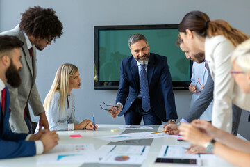 Business colleagues in conference meeting room during presentation
