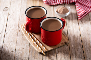 Traditional Mexican chocolate atole drink on wooden table