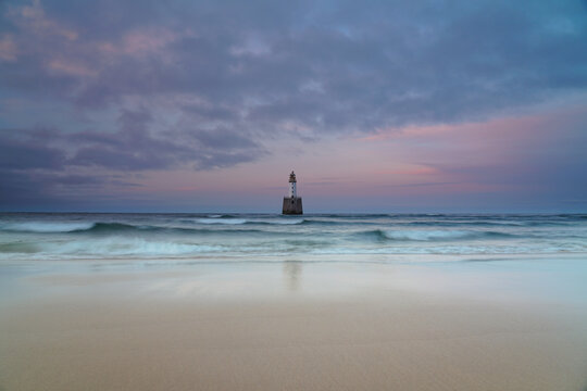 the lighthouse at Rattray head, Aberdeenshire, Scotland in this wide angle image.