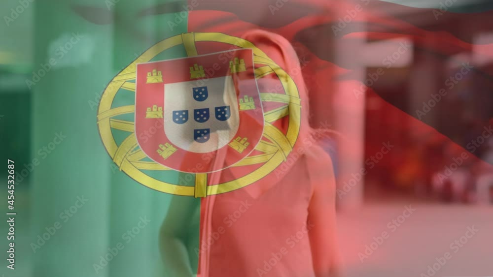 Wall mural Animation of flag of portugal waving over woman wearing face mask during covid 19 pandemic