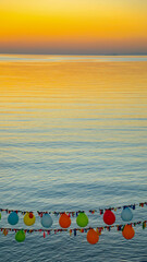 Colorful balloons and sunset on the lake