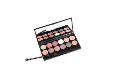 Eyeshadow palette. Black plastic case with twelve powder matte, glitter paint sample in purple, pink, brown, vanilla colors and brush. Top view makeup box isolated on white background