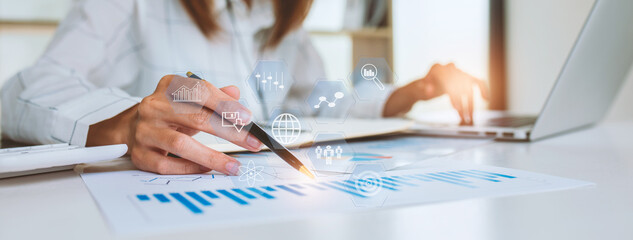 Close up of Business woman accountant or financial expert coins double exposure analyze business report graph finance chart corporate finance economy banking business stock market research concept.