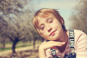 Funny outdoor portrait of 10 years old girl