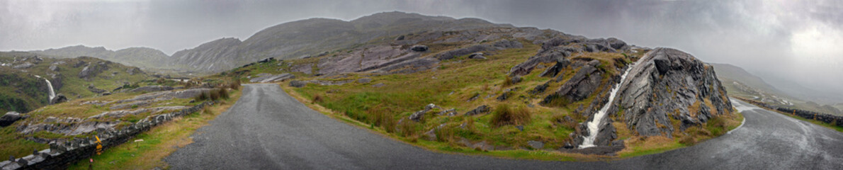 Fototapeta na wymiar Killarney Ireland Ring of Kerry. Road in the mountains. Foggy day. Rainy. Panorama.