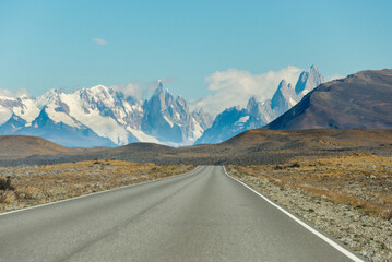 Fototapeta premium Long road crossing the border of Utah, USA, and Argentina