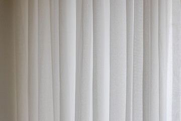Light and see through, Classic vintage white grey sheer curtains hanging by the window in living room with sunlight in the afternoon and blurred background. - obrazy, fototapety, plakaty
