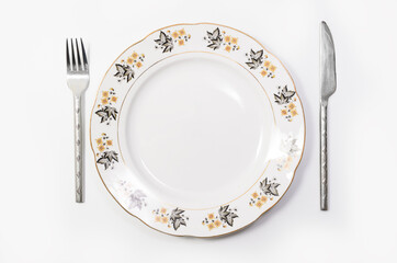 Luxury Vintage Porcelain tableware - Large Plate with Utensils on white background, top view