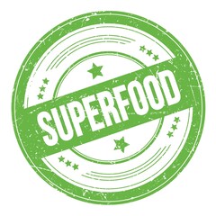 SUPERFOOD text on green round grungy stamp.