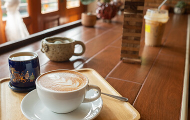 hot coffee cup on table at morning, relax time, latte coffee