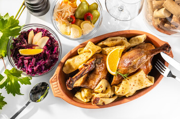 Roasted Duck in oven, with butlers and red cabbage salad, traditional Slovakian Duck and Goose feast
