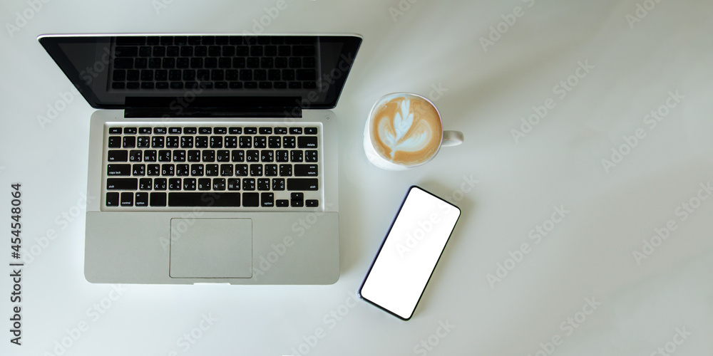 Aufkleber top view mock up smartphone with mouse computer laptop and coffee cup.copy space flat lay.