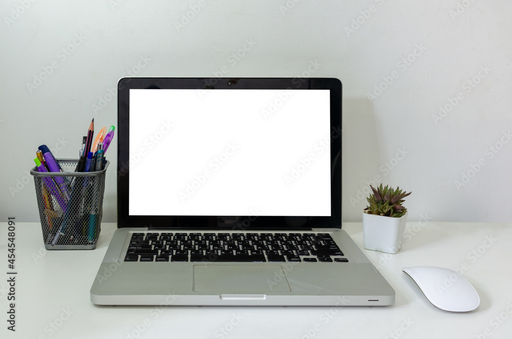 Poster computer laptop mock up and mouse cactus white blank screen on table. used to advertise text on the 