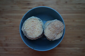 vegan crispy eggplant breaded with breadcrumbs stacked in bowl