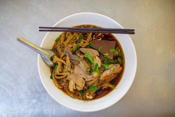 Top view Duck noodle on a white bowl,One of the menu of Thai street street noodles