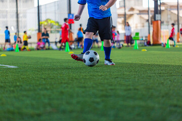 Obraz premium Children playing control soccer ball tactics on grass field with for training
