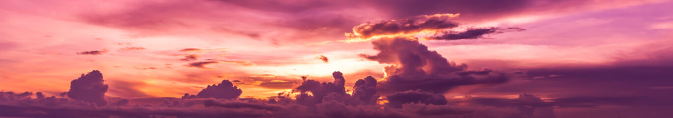 colorful sky with sun in clouds of altitude.panorama scenic of the strong sunrise with silver lining and cloud on the orange sky.