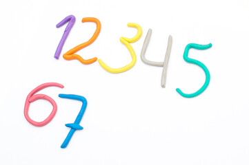 Colorful digits made from plasticine. Bright colored volumetric figures for children (isolated on white)