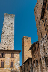 The historic center of San Gimignano, a typical medieval village in Tuscany. Narrow streets, numerous stone towers characterize the urban landscape