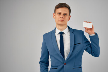 business man in a suit holding a business card Professional work