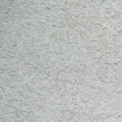 close-up grunge gray concrete wall texture background, cement walls are decorated with plastering techniques to have rough surface like cement dripping for decoration exterior facade building wall