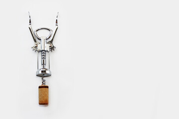 metal corkscrew for opening a wine bottle - obrazy, fototapety, plakaty
