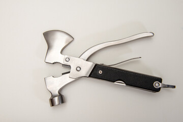 multi purpose tool on white background  ,camping and survival tools for every day .