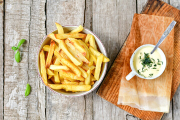  Home made   Fresh fried French fries  in a bowl on wooden rustic  background