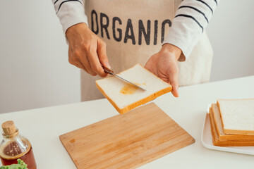 Delicious fried egg sandwich served on wooden board