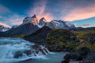 Sunrise over the Salto Grande cascades, with the Cuernos del Paine mountains - in Torres del Paine national park, Chile.