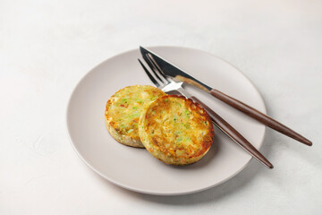 Vegetable vegan cauliflower, potato and broccoli cutlets in a plate on the table. Diet nutrition