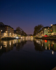 Fototapeta na wymiar Canal Saint-Marin at night in Paris, France