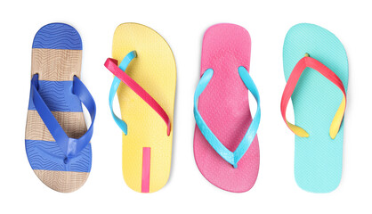 Set with different flip flops on white background, top view