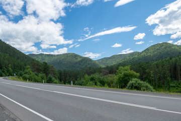 Mountain peaks and asphalt highway. Russia, mountain Altai