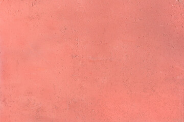 Light red old paint surface on the concrete wall texture background