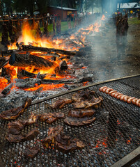 Asadores en la fiesta del asado en Cholila, Chubut, Patagonia con cordero, chivito y costillares...