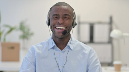 Portrait of Smiling African Man Wearing Headset, Call Center