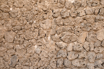 An old wall made from stones and clay. Textured wall for  background