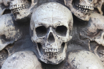 Artificial human skull close-up as background for postcard for congratulations to Halloween