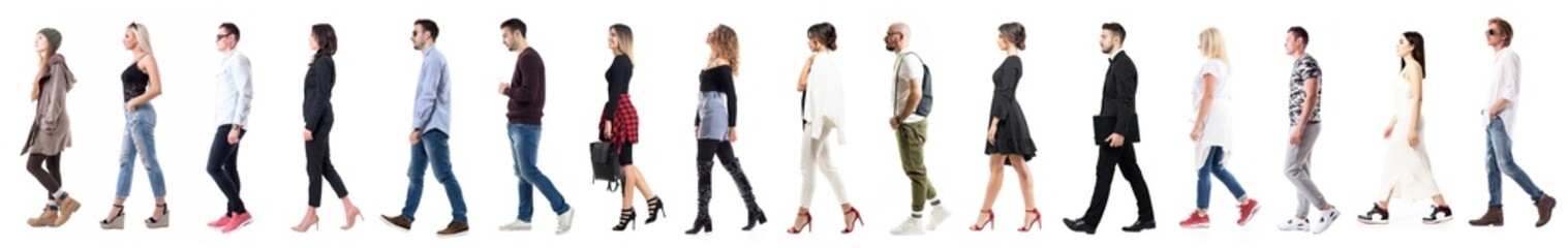 Side view of diverse group of people in casual or business clothing walking in a line. Full body...