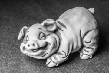 Little tourist souvenir sculpture of a pig