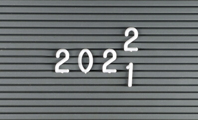 Year changing from 2021 to 2022, numbers on a typesetting board.
