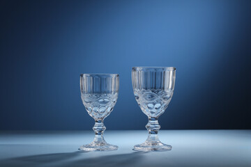 two glasses of wine on a blue background