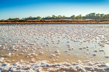 A pond full of salt after evaporation of ocean water at salines in Faro, Algarve, Portugal
