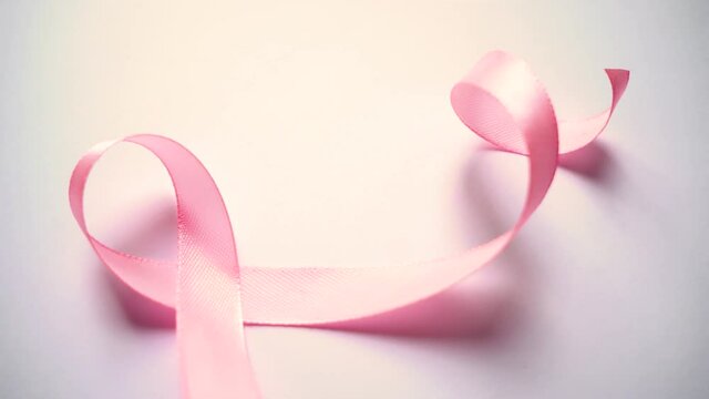 Pink silk ribbon, Symbol of world breast cancer awareness month in october.